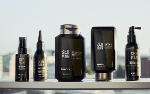 Set of Seb Man products standing on a steel railing, blurred city in the background