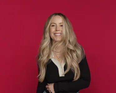 Nikki Lee portrait photo on a dark red background